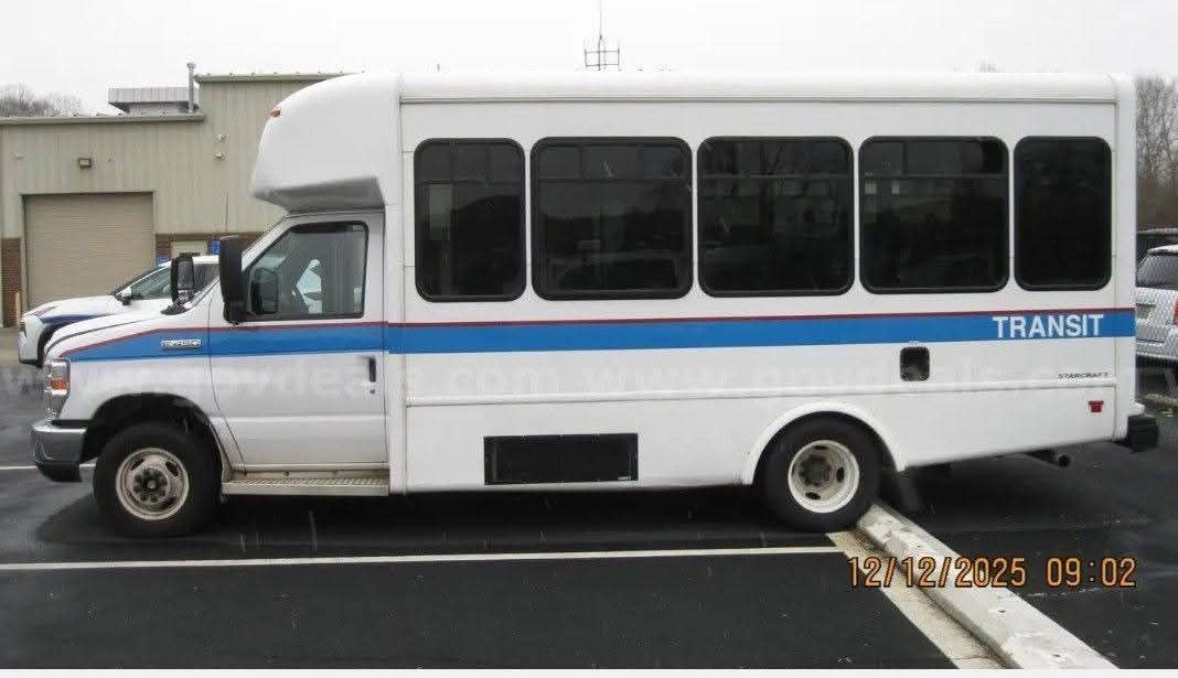 Side profile of the second All Transport Bus Co. party bus, exterior view